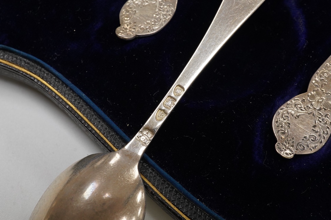 A cased set of six late Victorian engraved silver teaspoons with sugar tongs, Wakely & Wheeler, London, 1892, together with eight other silver teaspoons and a silver handled crumb brush.